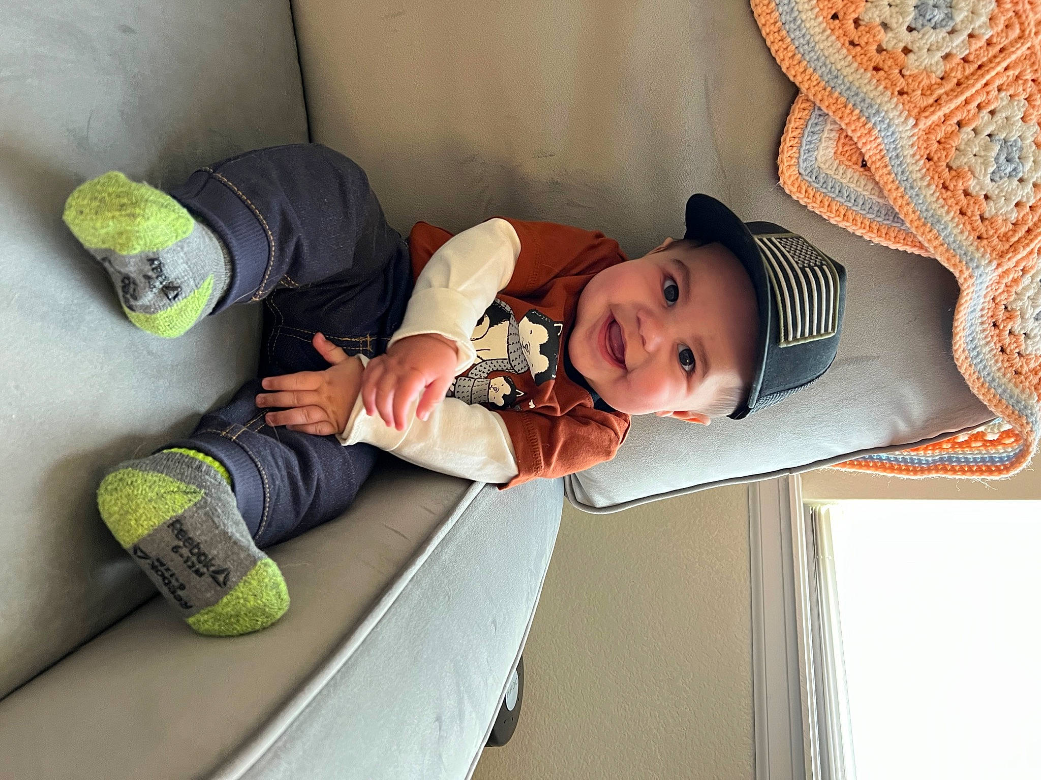 Eli joined the competition — help win amazing prizes! baby, baby_products, baby_toddler_clothing, child, comfort, fun, hat, headwear, joy, leg, linens, pattern, person, room, sitting, sock, sun_hat, textile, toddler, wood