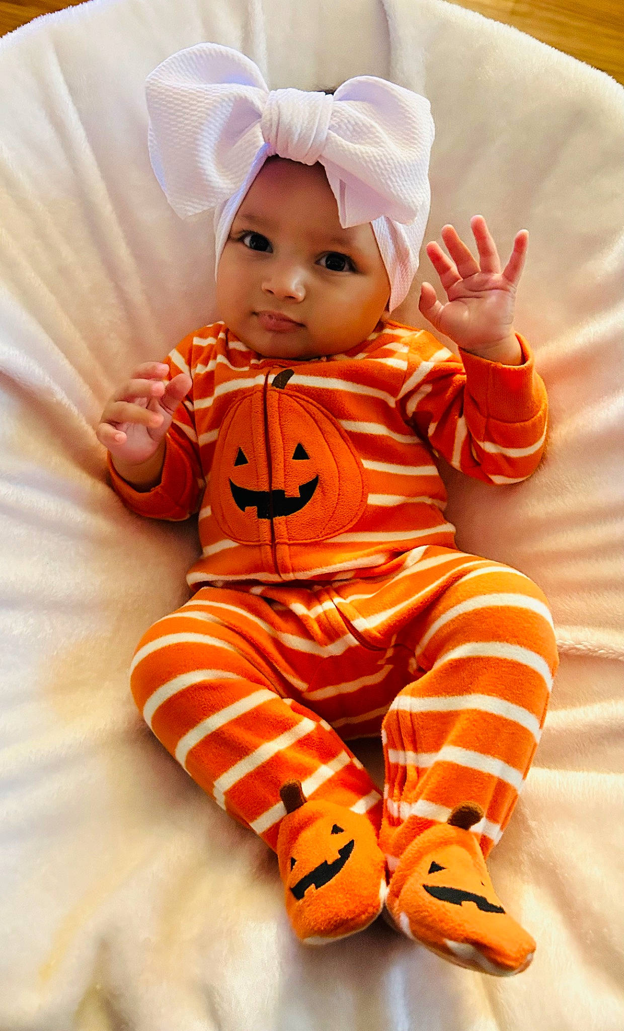 Kamaiya is registered to the contest to win money with this photo: baby, baby_toddler_clothing, baby_toys, child, doll, face, fictional_character, font, fur, gesture, happy, head, headwear, orange, peach, person, sleeve, textile, thumb, toddler