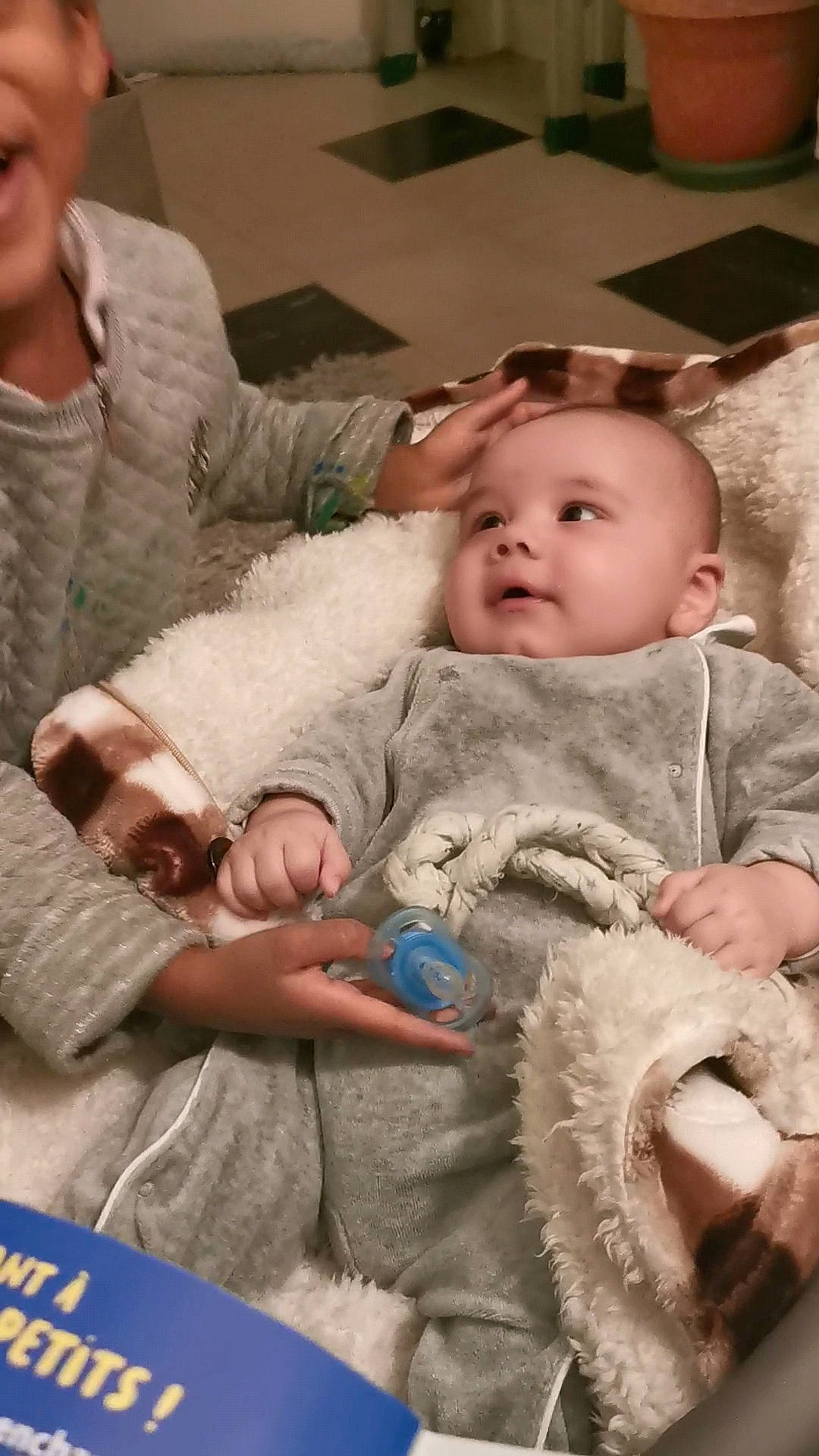 Elijah participe au concours pour gagner de l'argent avec cette photo : baby, baby_toddler_clothing, chair, cheek, child, comfort, event, finger, fun, fur, happy, human, iris, lap, person, room, sitting, skin, teddy_bear, textile