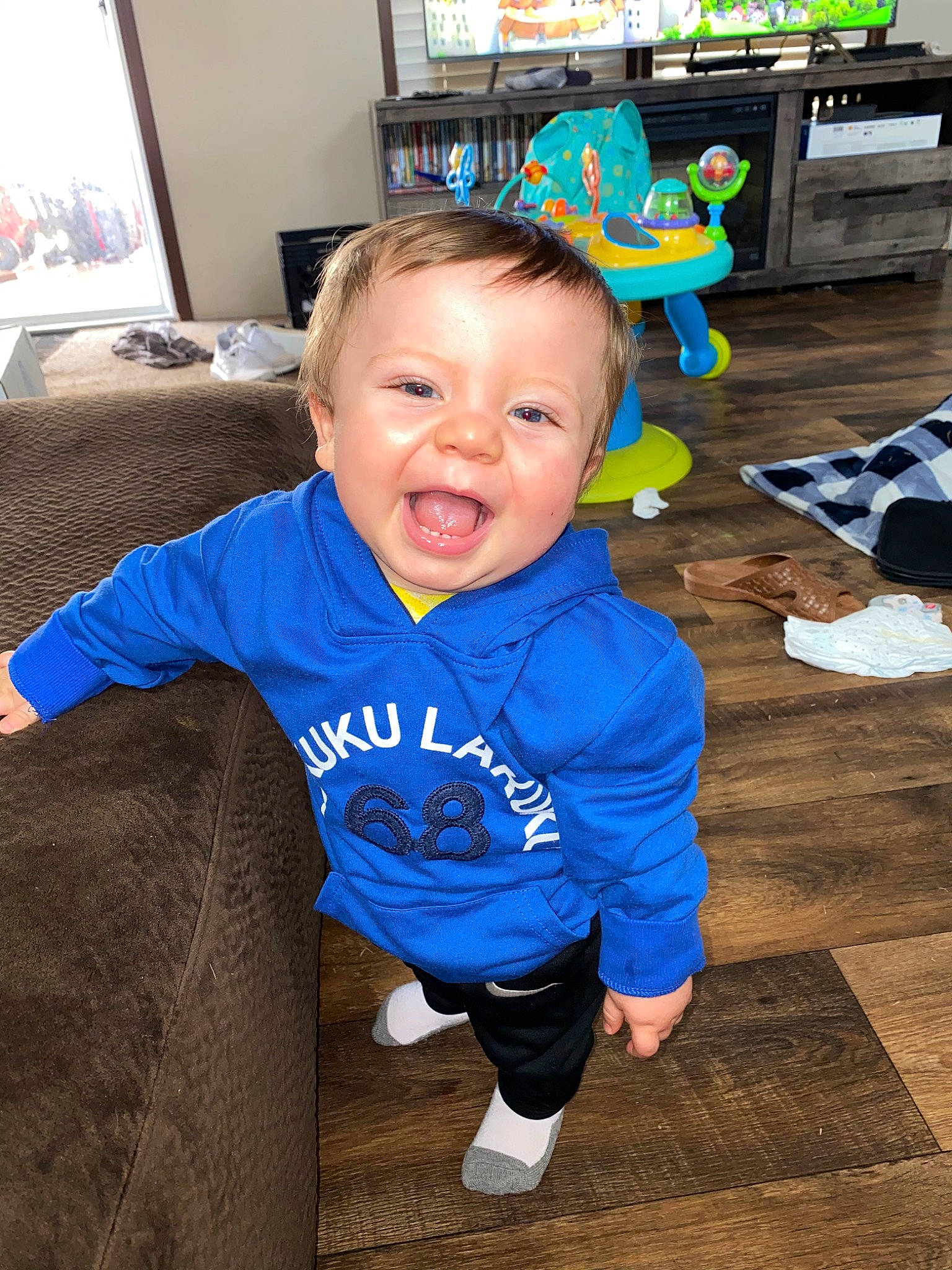 Rex is registered to the contest to win money with this photo: baby, blue, child, face, fun, happy, head, outerwear, people, person, play, skin, smile, t_shirt, toddler, vacation, world