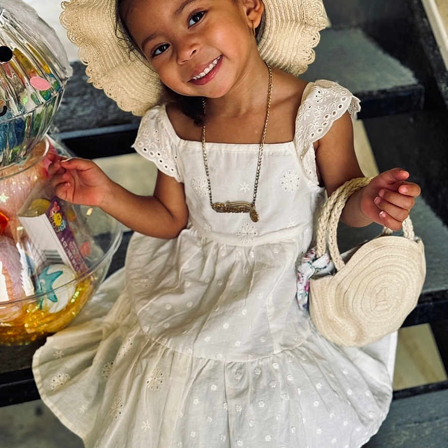 Leelani joined the competition — help win amazing prizes! accessories, bodypart, bonnet, child, clothing, dress, face, female, finger, girl, hand, happy, hat, head, jewelry, person, photography, portrait, smile, sunhat