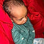 Kacen is registered to the contest to win money with this photo: baby, sleeping, infant, red_blanket, green_clothing, newborn, cozy, soft, peaceful, portrait, closeup, child, cute, resting, face, skin, hair, blanket, indoors, warm