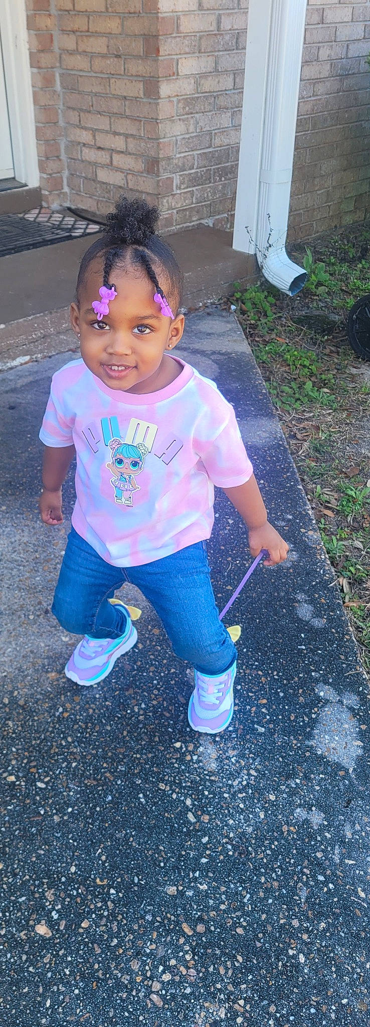 Eris is registered to the contest to win money with this photo: asphalt, baby_toddler_clothing, blue, child, cool, electric_blue, eye, face, facial_expression, fun, grass, hairstyle, magenta, people_in_nature, person, photograph, purple, t_shirt, toddler, violet