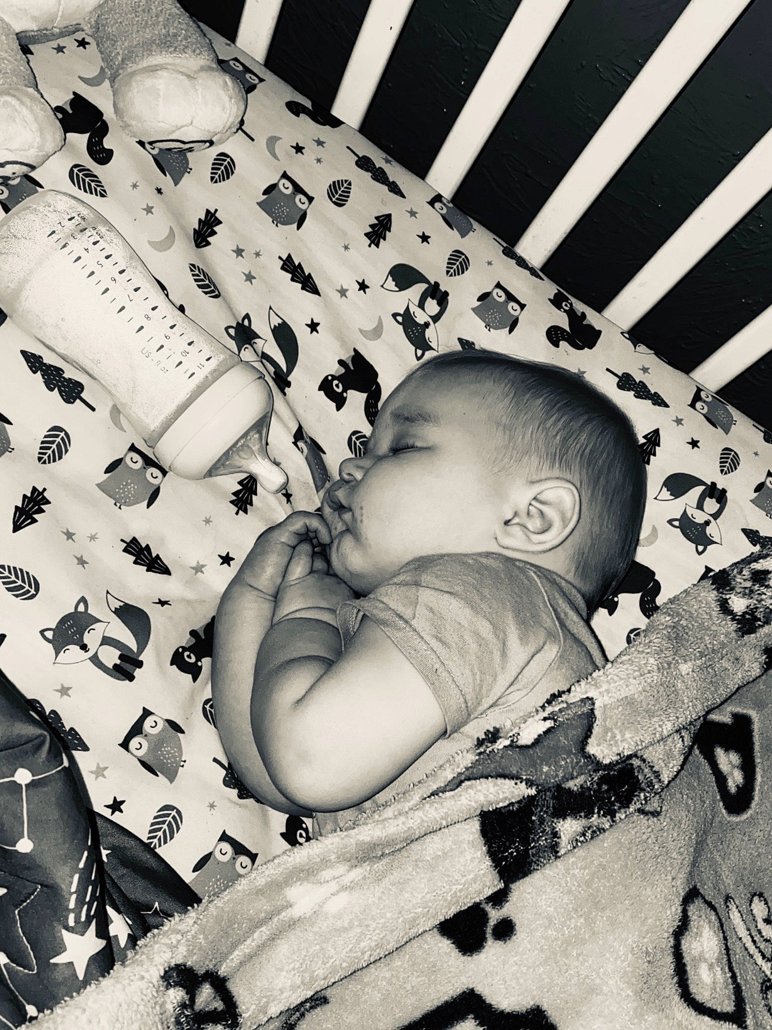 Xavier is registered to the contest to win money with this photo: arm, baby, baby_toddler_clothing, black, black_and_white, child, comfort, cool, facial_expression, hairstyle, hand, happy, human, line, mouth, organ, person, photograph, style, toddler