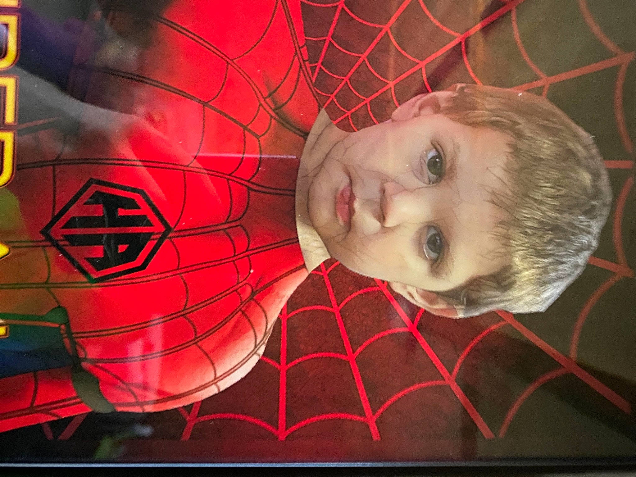 Allen Jr is registered to the contest to win money with this photo: art, carmine, display_device, fictional_character, flash_photography, flesh, flooring, graphics, lip, magenta, mouth, organ, pattern, person, picture_frame, red, room, smile, symmetry, television_set