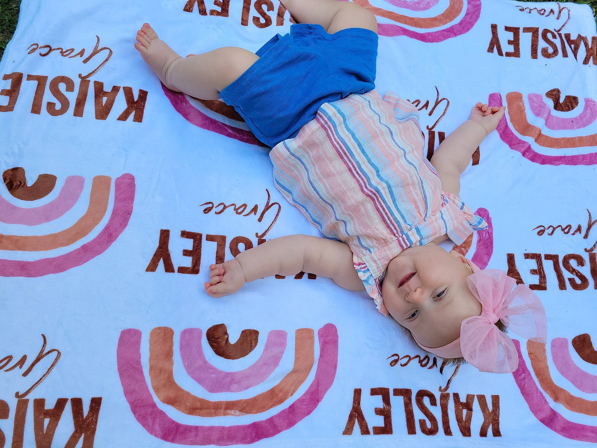 Kaisley is registered to the contest to win money with this photo: advertising, baby, baby_toddler_clothing, electric_blue, event, facial_expression, finger, font, gesture, graphics, happy, headwear, logo, nail, pattern, person, pink, poster, sleeve, t_shirt