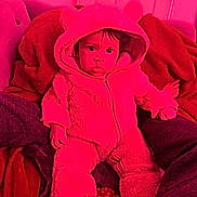 Jadeliz Linette joined the competition — help win amazing prizes! baby, child, onesie, hood, blanket, cushion, furniture, indoor, cozy, soft, cute, person, infant, feet, face, expression, warm, plush, seated, home