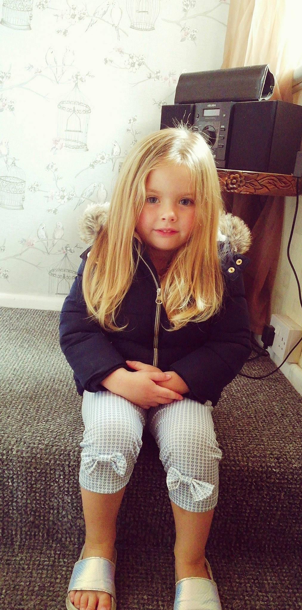 Rosa is registered to the contest to win money with this photo: bangs, beauty, blond, brown_hair, child, child_model, clothing, fashion_accessory, hair, hairstyle, human_leg, knee, leg, long_hair, person, photography, shorts, sitting, smile, thigh