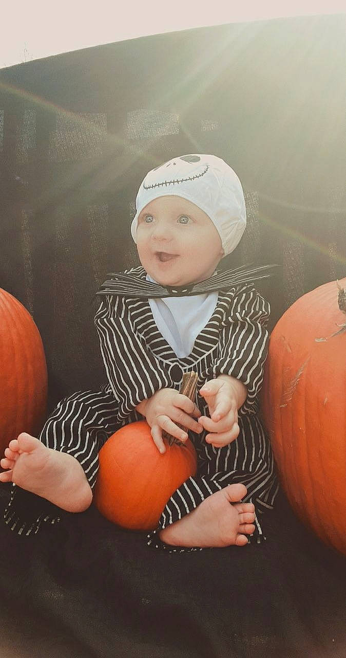Carter is registered to the contest to win money with this photo: baby_toddler_clothing, beanie, bonnet, calabaza, cap, child, cucurbita, finger, gourd, hand, headgear, headwear, orange, peach, person, produce, pumpkin, squash, toddler, vegetable