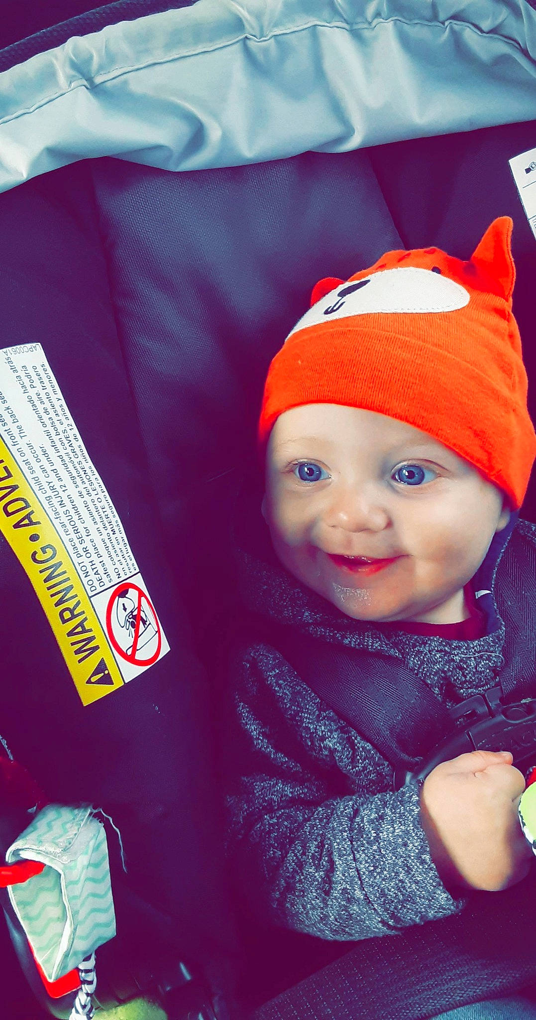 Carter is registered to the contest to win money with this photo: baby, baby_laughing, baby_toddler_clothing, bonnet, child, costume_accessory, facial_expression, fictional_character, headgear, headwear, hood, linens, nose, person, pleased, textile, toddler, watch