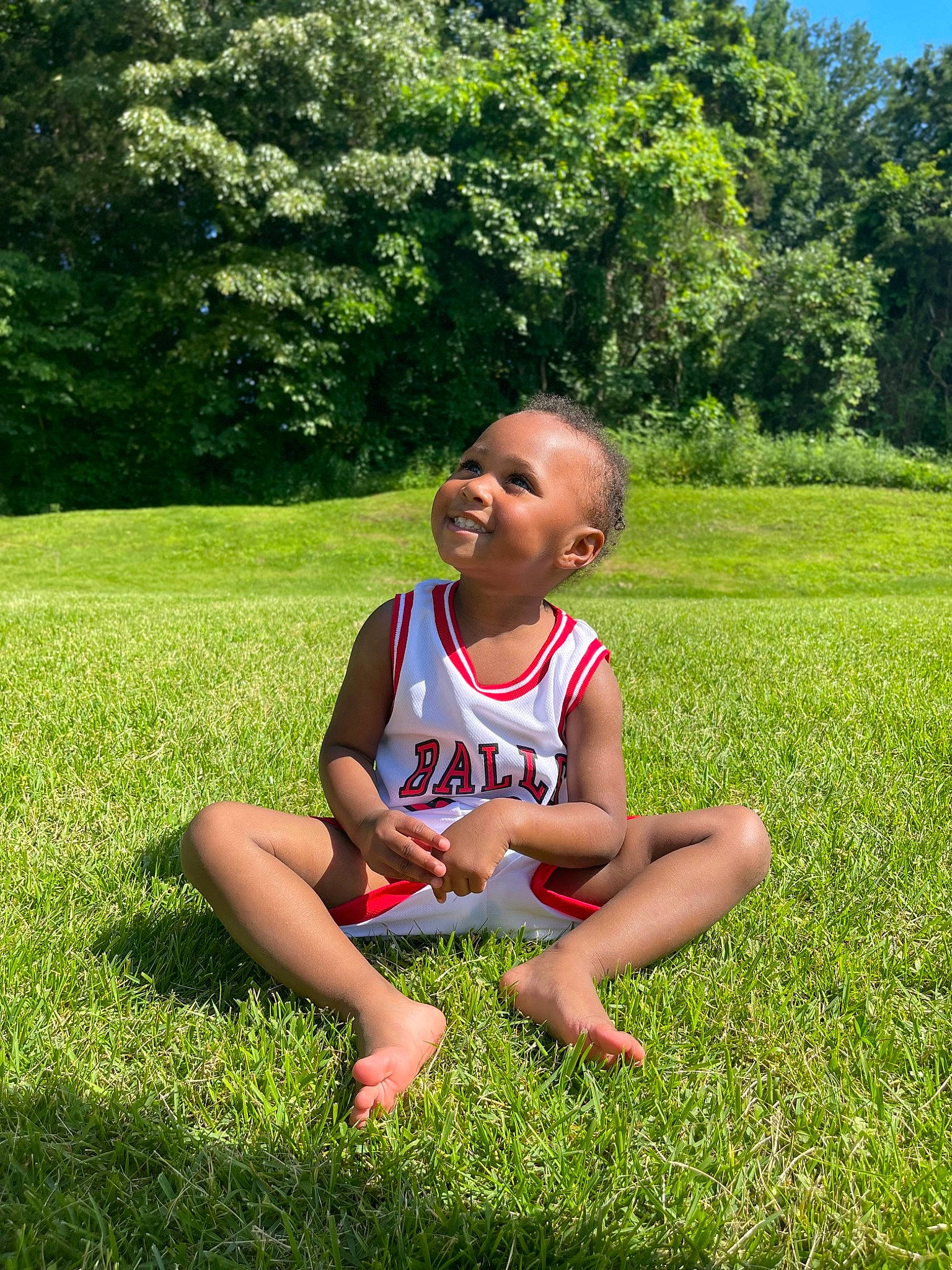Alaia joined the competition — help win amazing prizes! baby_toddler_clothing, barefoot, foot, grass, grassland, green, groundcover, happy, joy, leisure, meadow, people_in_nature, person, plant, recreation, sandal, shrub, smile, summer, sunlight