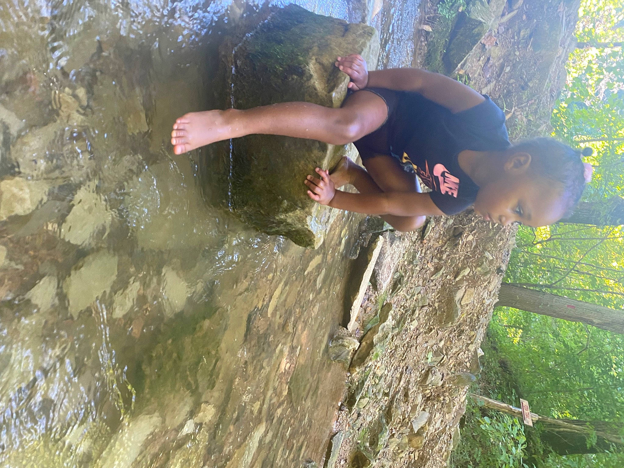 Alaia is registered to the contest to win money with this photo: adventure, bedrock, elbow, fun, grass, happy, hat, landscape, leisure, people_in_nature, person, plant, recreation, rock, soil, stream, tree, trunk, vacation, water