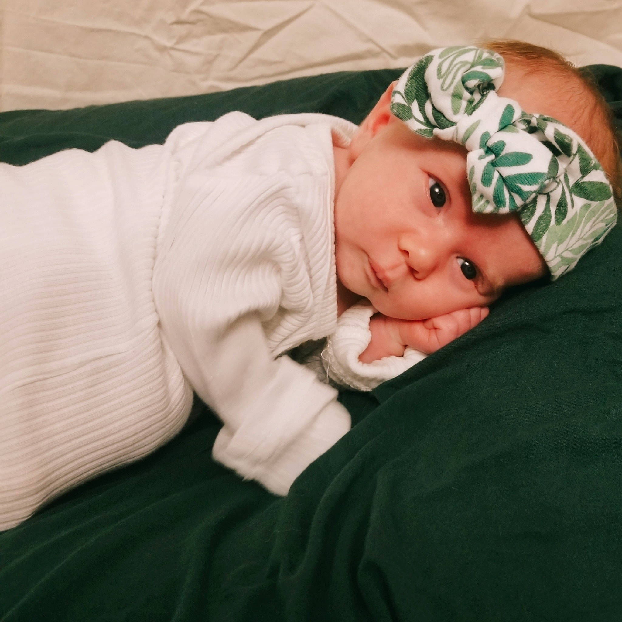 Amilia is registered to the contest to win money with this photo: baby, baby_products, baby_toddler_clothing, bedtime, cap, cheek, child, comfort, fashion_accessory, grass, hand, hat, headwear, linens, nap, person, room, sitting, sleep, sleeve