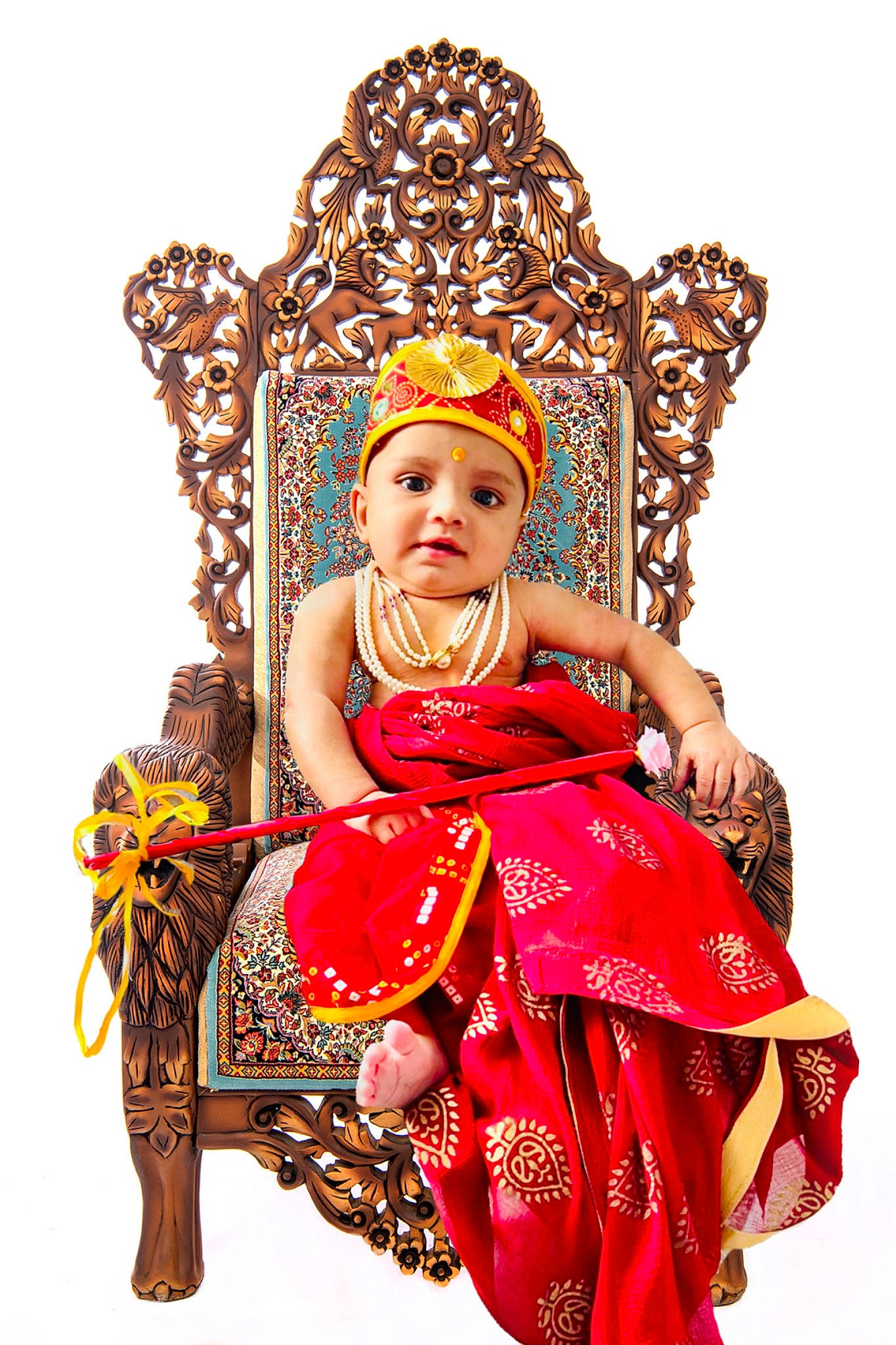 Aryan is registered to the contest to win money with this photo: baby, chair, child, crown, event, fashion_accessory, fashion_design, fictional_character, formal_wear, fun, hair_accessory, happy, headpiece, headwear, jewellery, magenta, pattern, peach, person, sitting