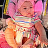 Doha Mehrish is registered to the contest to win money with this photo: baby, infant, car_seat, pink, headband, bow, striped_dress, foot, hand, cushion, child, sunlight, indoor, seat, clothing, person, cute, skin, baby_accessory, comfort