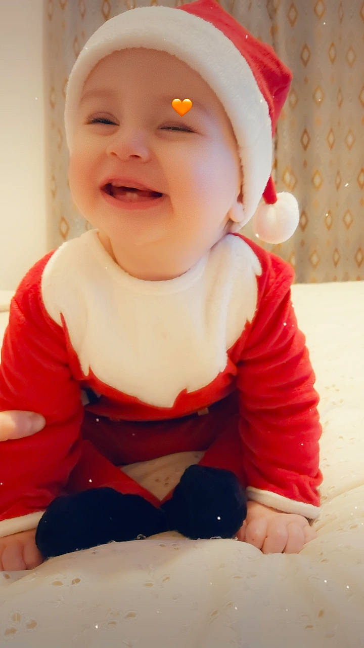 Deyan participe au concours pour gagner de l'argent avec cette photo : baby, baby_toddler_clothing, cap, carmine, cheek, child, chin, costume_hat, dress, happy, hat, headwear, joy, lip, pattern, person, pink, sitting, skin, sleeve