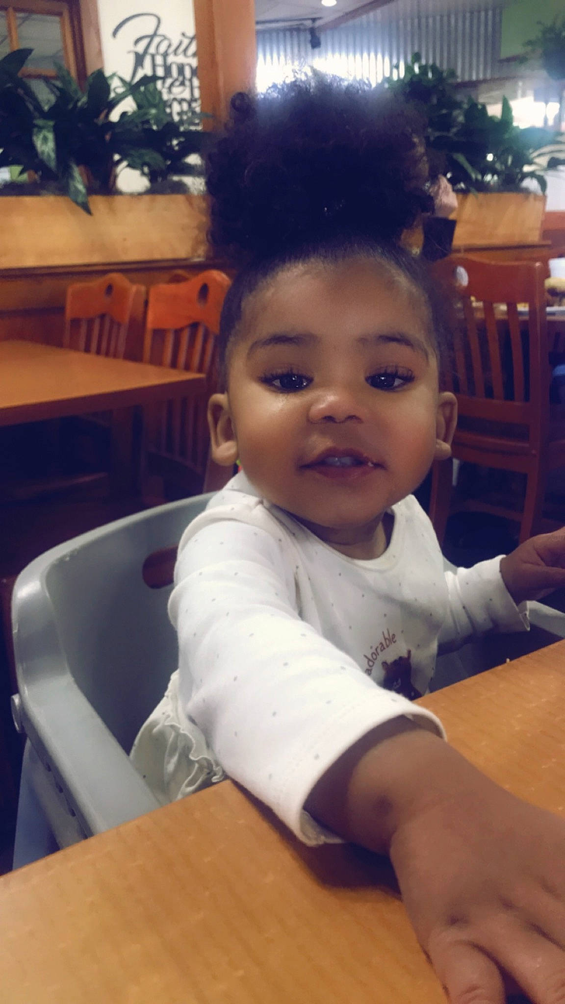 Kyleigh is registered to the contest to win money with this photo: afro, black_hair, chair, cheek, child, chin, desk, eyelash, fun, furniture, happy, houseplant, iris, nose, person, skin, smile, t_shirt, table, thumb