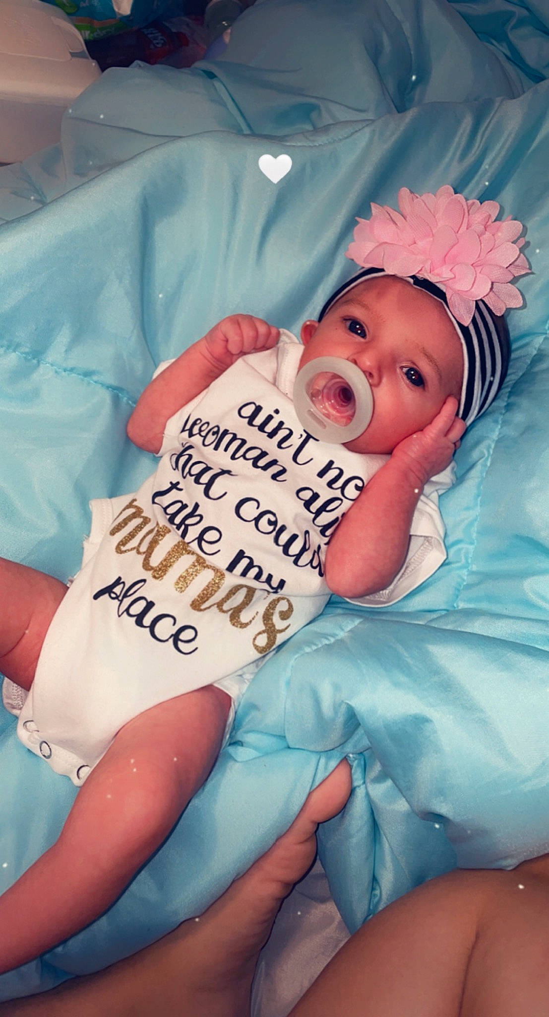 Madilynn is registered to the contest to win money with this photo: baby, baby_products, baby_toddler_clothing, comfort, event, finger, gesture, hand, happy, hat, head, headwear, health_care, human_body, linens, person, pink, skin, textile, thigh