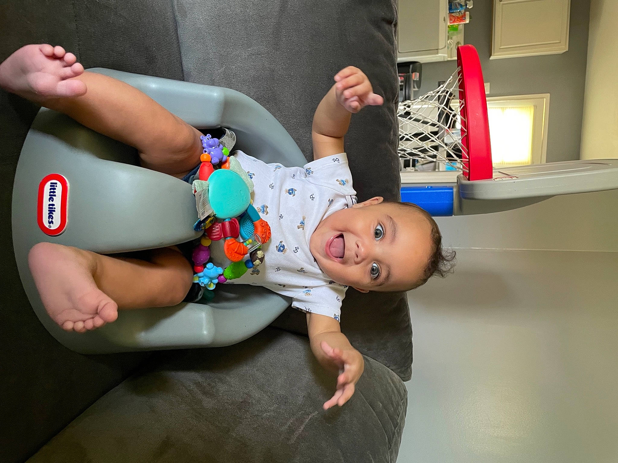Kobi joined the competition — help win amazing prizes! baby, baby_products, baby_toddler_clothing, child, comfort, facial_expression, fun, human_body, human_leg, joint, knee, leg, leisure, person, room, sandal, shoulder, sitting, smile, thigh