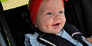 Tallulah joined the competition — help win amazing prizes! baby, child, stroller, red_bow, headband, smiling, happy, outdoor, sunlight, blanket, blue_dress, safety_harness, face, infant, cute, person, closeup, daylight, seat, cheerful