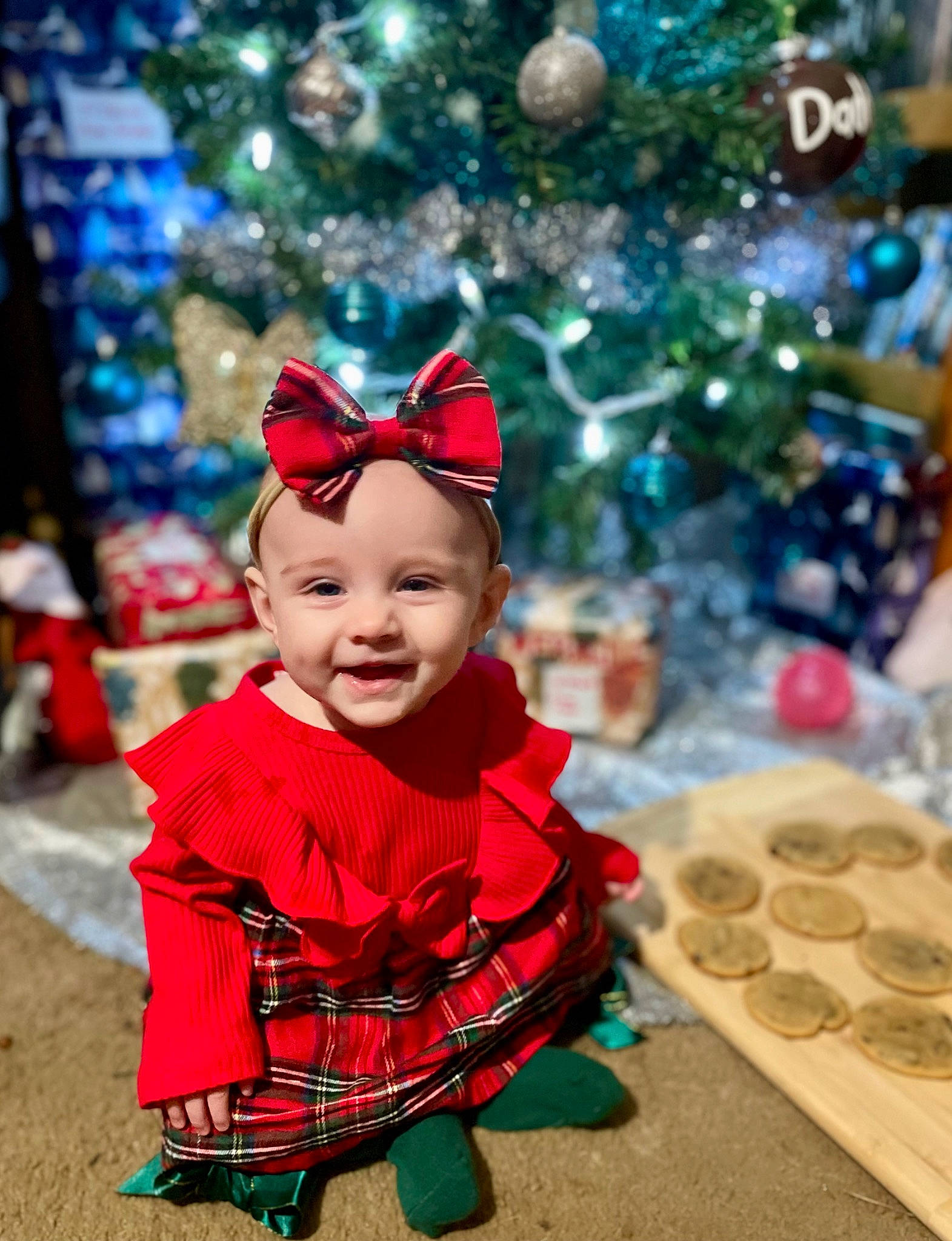 Freya joined the competition — help win amazing prizes! baby_toddler_clothing, child, christmas, christmas_decoration, christmas_eve, christmas_ornament, christmas_tree, costume_hat, event, fun, happy, headwear, holiday, joy, ornament, person, plant, smile, snapshot, toddler