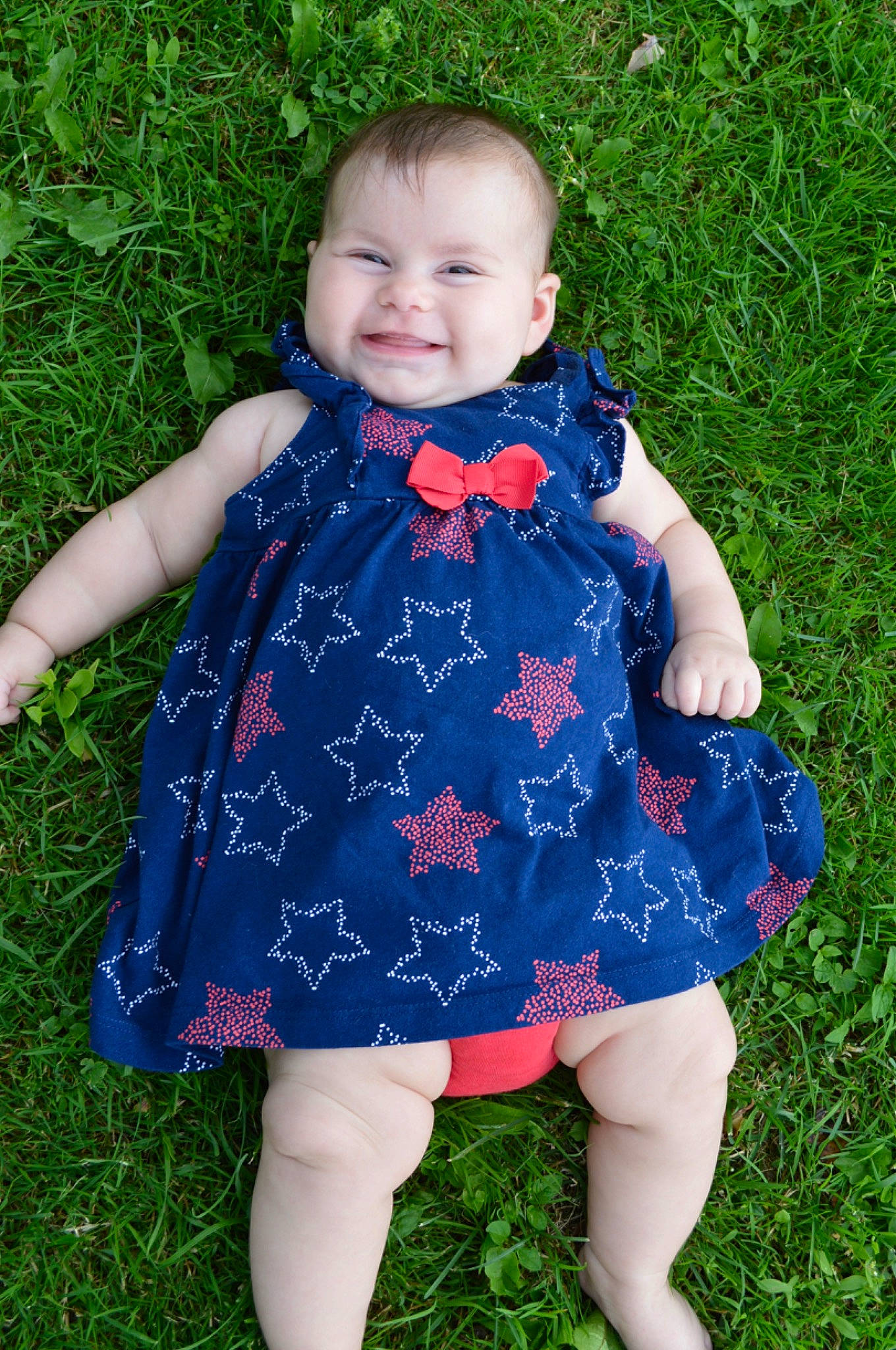 Evelynn joined the competition — help win amazing prizes! baby_toddler_clothing, child, clothing, dress, electric_blue, face, finger, grass, human_body, joy, leaf, mammal, one_piece_garment, pattern, people_in_nature, person, photograph, plant, purple, sleeve