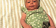 Hayvin joined the competition — help win amazing prizes! baby, infant, child, headband, bow, romper, green, floral, blanket, white, sign, text, handmade, milestone, age, cute, lying_down, celebration, smiling, indoors