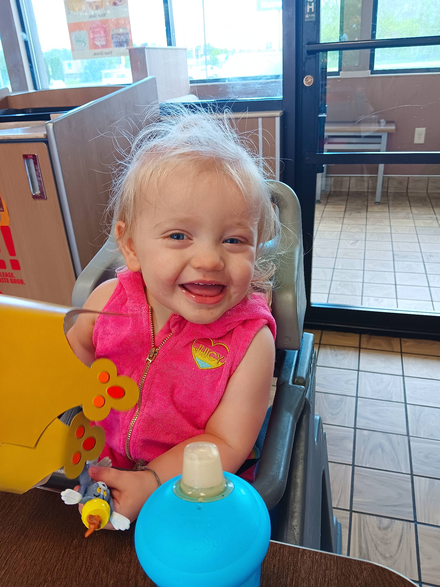 Lyndel joined the competition — help win amazing prizes! accessories, baby, bodypart, bottle, chair, couch, device, face, finger, furniture, hand, happy, head, indoors, jewelry, necklace, person, photography, portrait, sitting