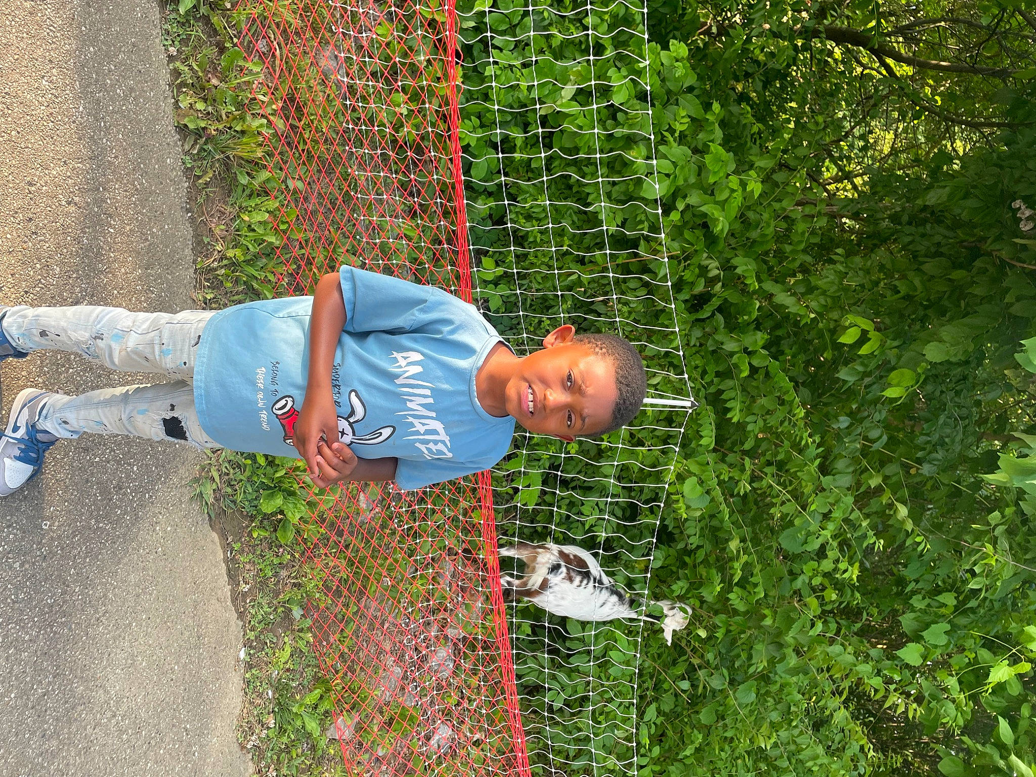 Demetrius joined the competition — help win amazing prizes! chain_link_fencing, denim, fun, garden, grass, grass_family, groundcover, landscape, lawn, leisure, mesh, net, people_in_nature, person, plant, shrub, soil, t_shirt, tree, walking_shoe