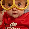 Tara is registered to the contest to win money with this photo: cheek, child, cool, eyewear, face, glasses, goggles, head, nose, personal_protective_equipment, smile, toddler, yellow