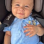 baby, smiling, blue_eyes, romper, car_seat, child, infant, cute, happy, clothing, seatbelt, person, portrait, hand, skin, head, young_child, casual, comfort, playful