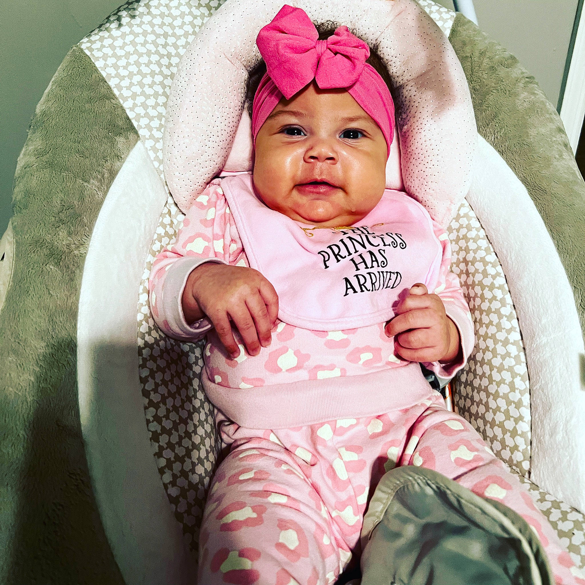 Kensley is registered to the contest to win money with this photo: baby, baby_carriage, baby_products, baby_safety, baby_sleeping, baby_toddler_clothing, cap, cheek, comfort, eyelash, fashion_accessory, happy, headwear, linens, person, pink, product, sitting, sleeve, smile