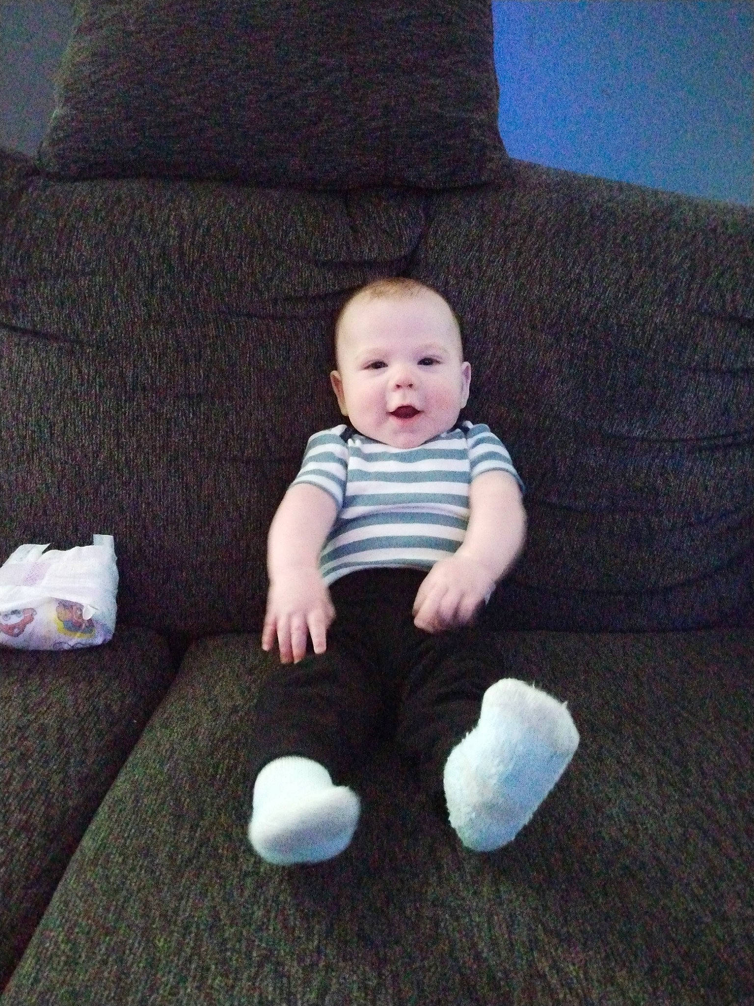 Liam joined the competition — help win amazing prizes! arm, baby, baby_toddler_clothing, cheek, comfort, couch, electric_blue, flash_photography, flooring, grey, head, human_body, human_leg, knee, linens, person, sleeve, sock, t_shirt, toddler