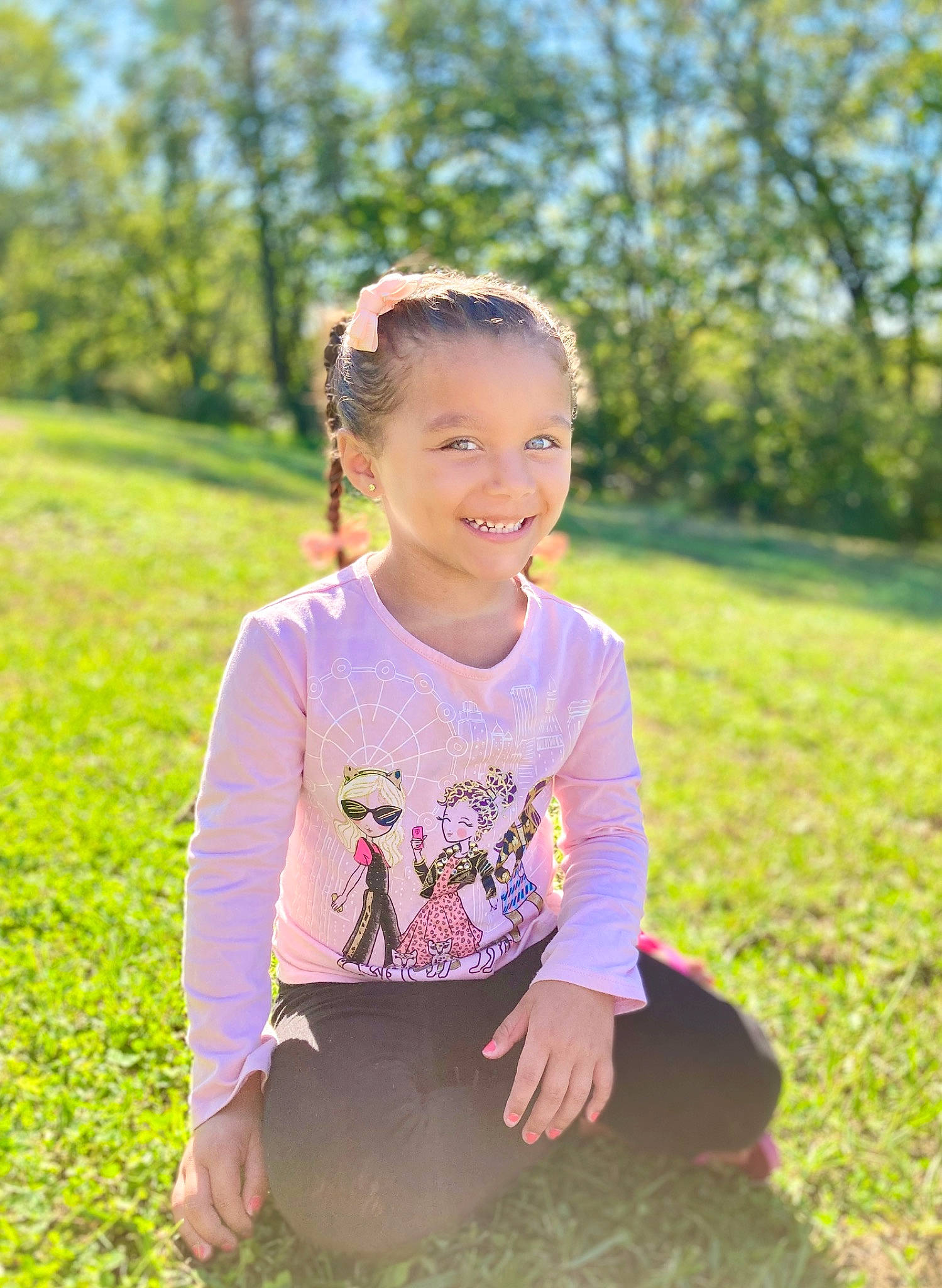 Korrah is registered to the contest to win money with this photo: baby_toddler_clothing, child, eye, face, flash_photography, fun, grass, grass_family, grassland, green, happy, joy, leisure, meadow, people_in_nature, person, plant, recreation, sleeve, smile