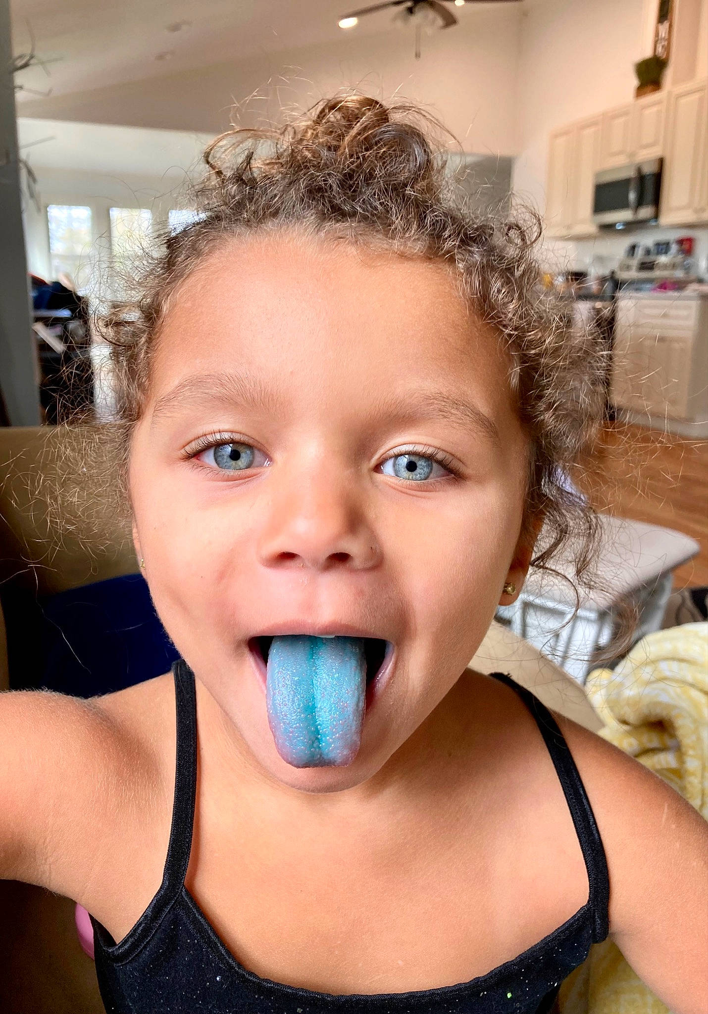 Korrah is registered to the contest to win money with this photo: black_hair, cheek, chin, ear, eyebrow, eyelash, finger, happy, human_body, jaw, lip, mouth, neck, nose, person, shoulder, skin, smile, tableware, toddler