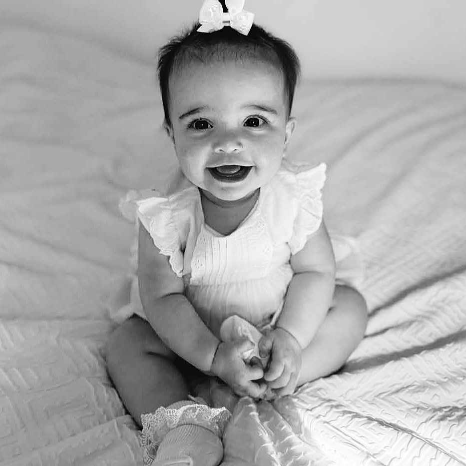 Isla-Kate joined the competition — help win amazing prizes! baby, babylaughing, bed, bedroom, bodypart, clothing, diaper, face, furniture, happy, head, indoors, laughing, pants, person, photography, portrait, room, sitting, smile