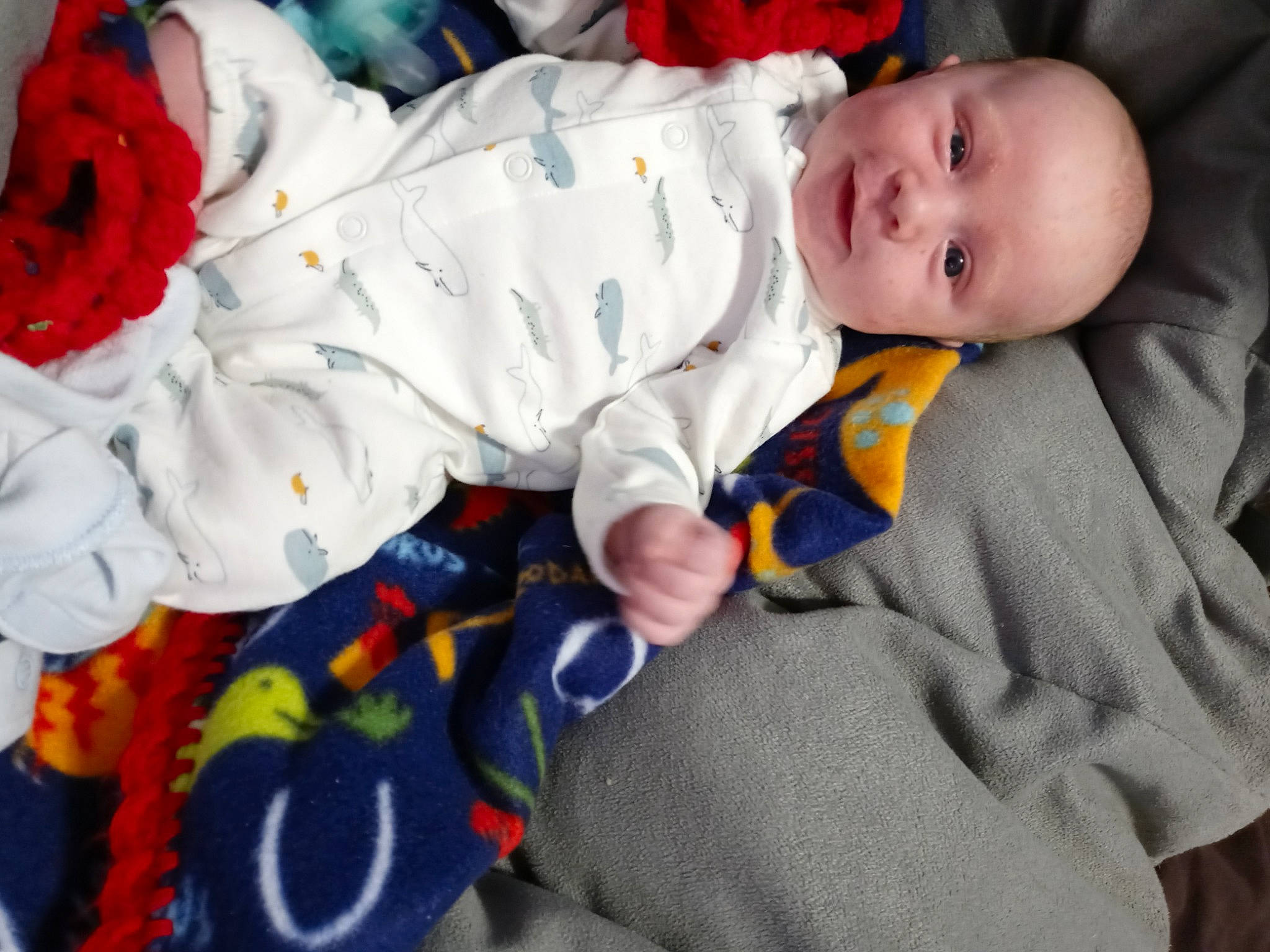 Adam joined the competition — help win amazing prizes! baby, baby_products, baby_toddler_clothing, carmine, cheek, child, comfort, eye, face, flooring, head, human_body, linens, orange, person, room, sitting, skin, sleeve, textile