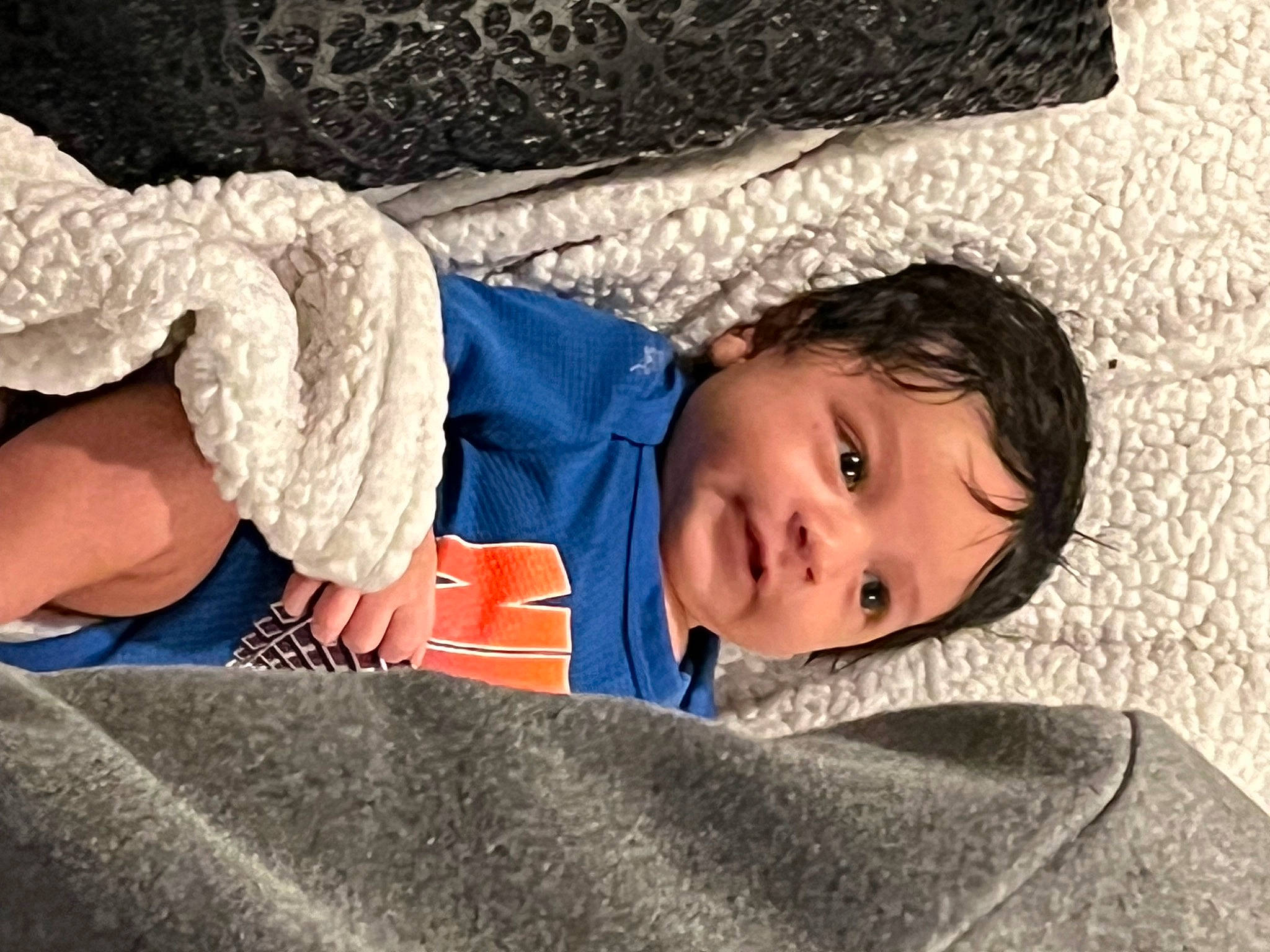 Marquez is registered to the contest to win money with this photo: baby, baby_toddler_clothing, child, comfort, couch, denim, electric_blue, fun, fur, linens, person, room, sitting, sleeve, smile, toddler, tree