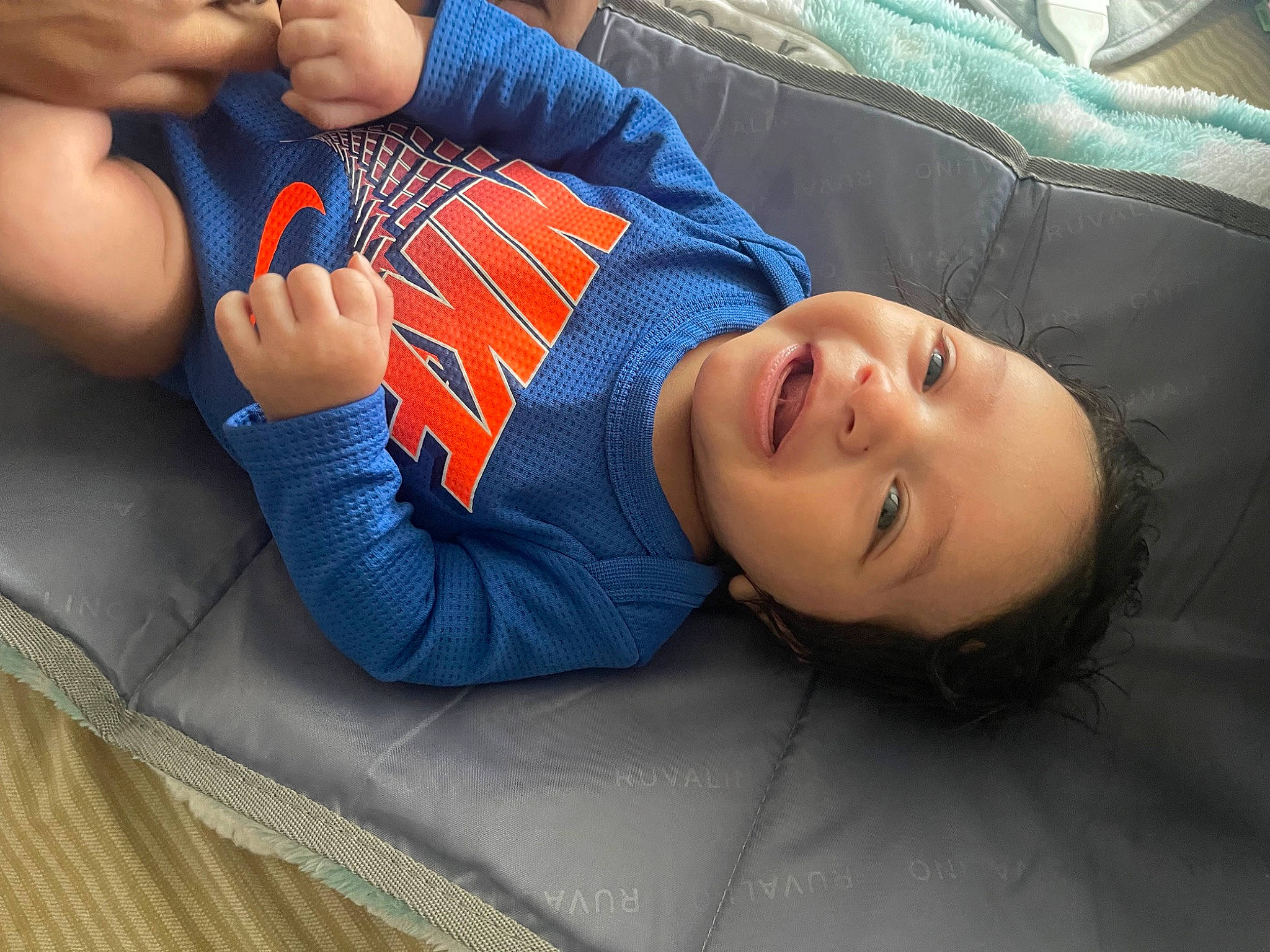 Marquez Antonio West is registered to the contest to win money with this photo: baby, child, comfort, couch, elbow, electric_blue, foot, fun, gesture, hand, human_leg, joint, knee, mouth, nail, person, smile, thigh, thumb, toddler