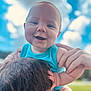 baby, child, smiling, blue_sky, clouds, outdoor, person, shoulders, happy, face, hands, short_hair, holding, young_child, sunlight, nature, portrait, skin, joy, casual_clothing