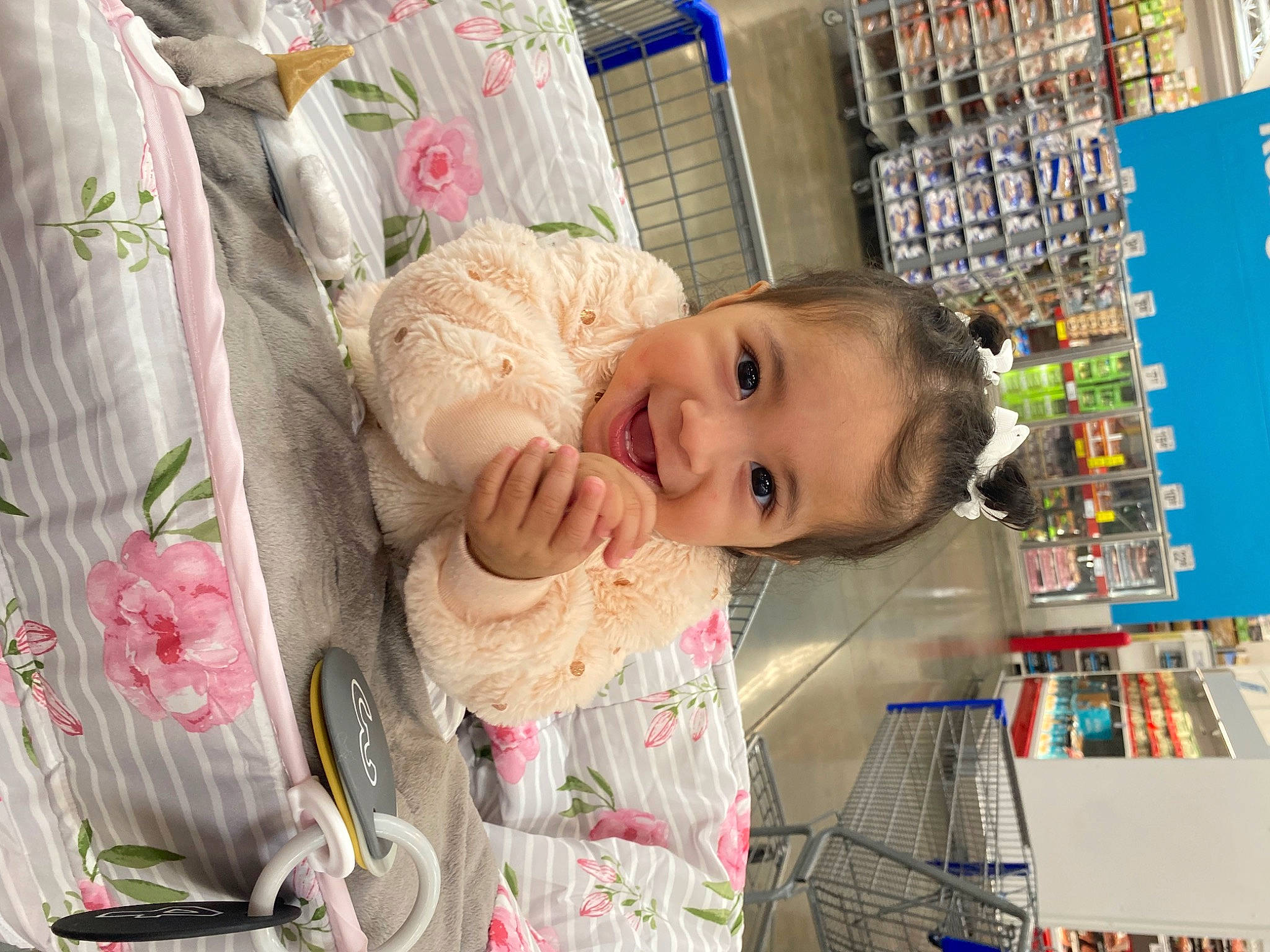 Eliana is registered to the contest to win money with this photo: baby, baby_products, baby_safety, baby_toddler_clothing, building, cheek, child, clothing, customer, happy, pattern, person, plant, product, publication, retail, room, shelf, shelving, smile