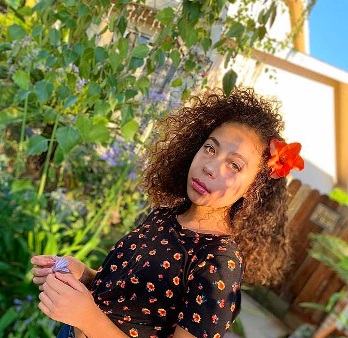 Kyana Roberts joined the competition — help win amazing prizes! beauty, botany, brown_hair, fawn, fun, grass, happy, leaf, leisure, long_hair, pattern, people_in_nature, person, plant, shoulder, sitting, smile, sunlight, tints_and_shades, tree