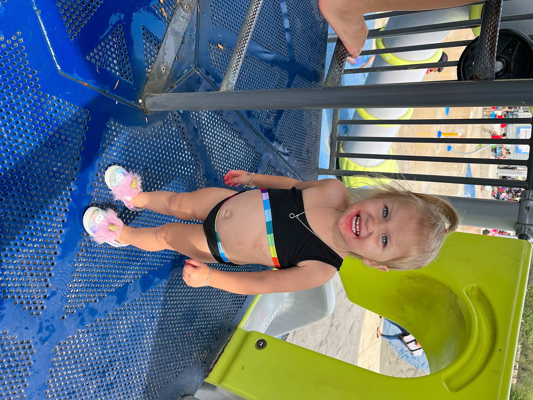 Queen is registered to the contest to win money with this photo: blue, chest, child, elbow, electric_blue, foot, fun, human_body, human_leg, joy, knee, leg, leisure, pattern, person, recreation, shelf, smile, swimwear, thigh