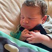 Malachi joined the competition — help win amazing prizes! newborn, baby, sleeping, blanket, pacifier, infant, hands, cozy, soft_light, portrait, cute, child, resting, indoors, closeup, peaceful, toddler, curly_hair, face, sleep