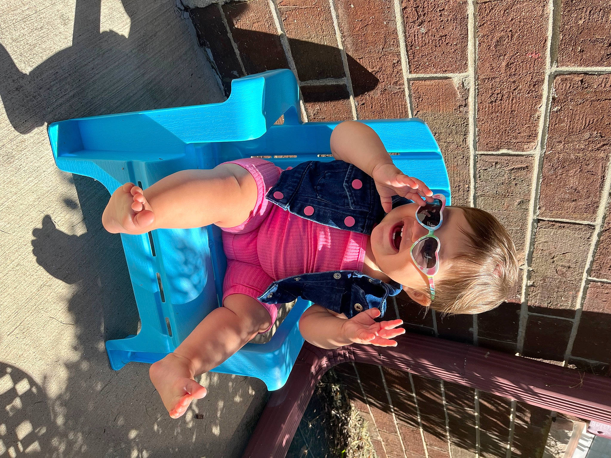 Cataleya is registered to the contest to win money with this photo: art, brick, brickwork, electric_blue, eyewear, fun, happy, hat, human_leg, leisure, pattern, person, sunglasses, thigh, vacation, visual_arts, water