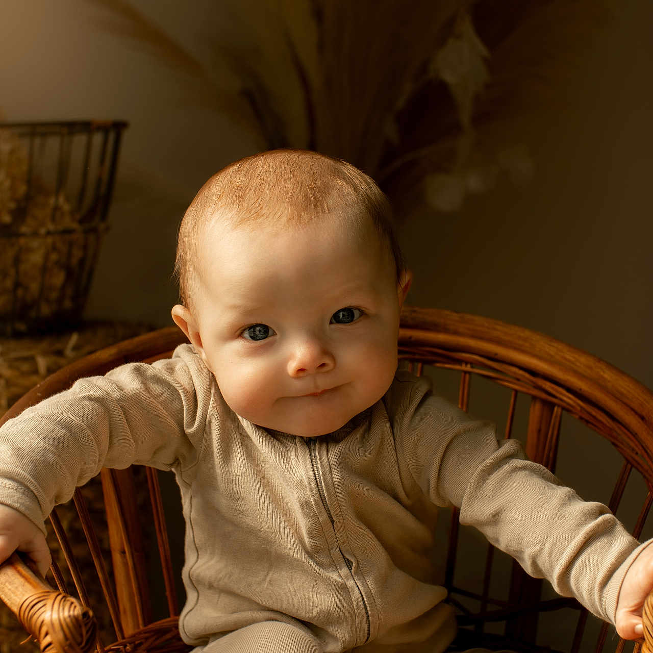 Jameson is registered to the contest to win money with this photo: armchair, baby, bodypart, chair, clothing, face, finger, furniture, hand, happy, hardwood, head, knitwear, person, photography, portrait, sitting, smile, sweater, wood