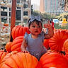 Mía Karla is registered to the contest to win money with this photo: autumn, baby, bow, child, city, dress, fall, festival, fist, girl, gourds, inflatable_duck, orange, outdoor, portrait, pumpkin, pumpkin_patch, smiling, toddler, urban