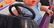 Mía Karla joined the competition — help win amazing prizes! amusement_park, autumn, blue_dress, bow, car, child, family_fun, festive, girl, headband, outdoor, portrait, portrait_photography, pumpkins, ride, smiling, steering_wheel, toddler, toy_car, vehicle