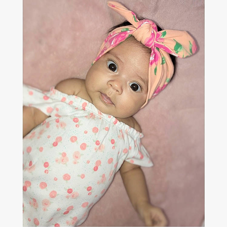 Aaylah is registered to the contest to win money with this photo: baby, beige, brown_hair, child, design, doll, ear, pattern, person, pink, polka_dot, toddler, toy