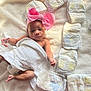 Amoura joined the competition — help win amazing prizes! baby, infant, towel, pink_bow, headband, diapers, blanket, laying_down, newborn, soft_texture, cute, small_hands, small_feet, indoors, person, child, skin, sleepwear, resting, babycare